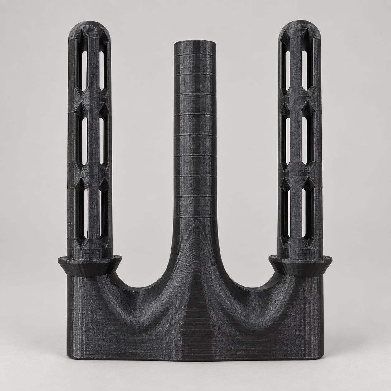 Prefilter adapter on its own, showing the two slotted sponge supports and the central intake stem