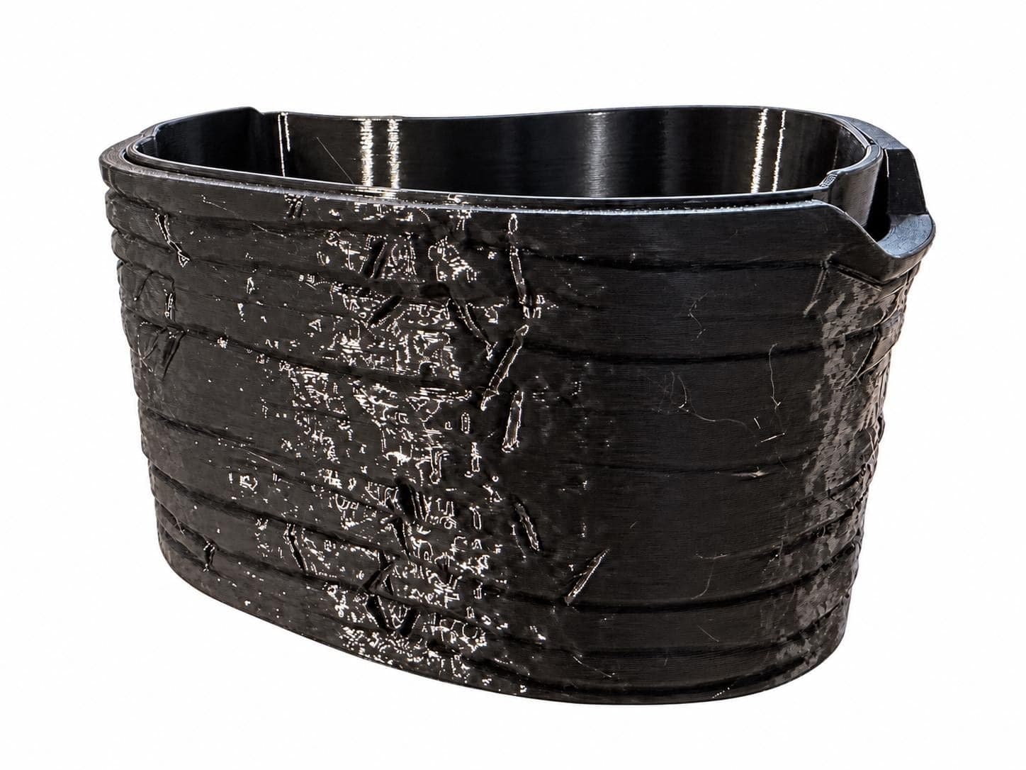 Back of the assembled plant cup, showing the side grip tabs above the textured shell