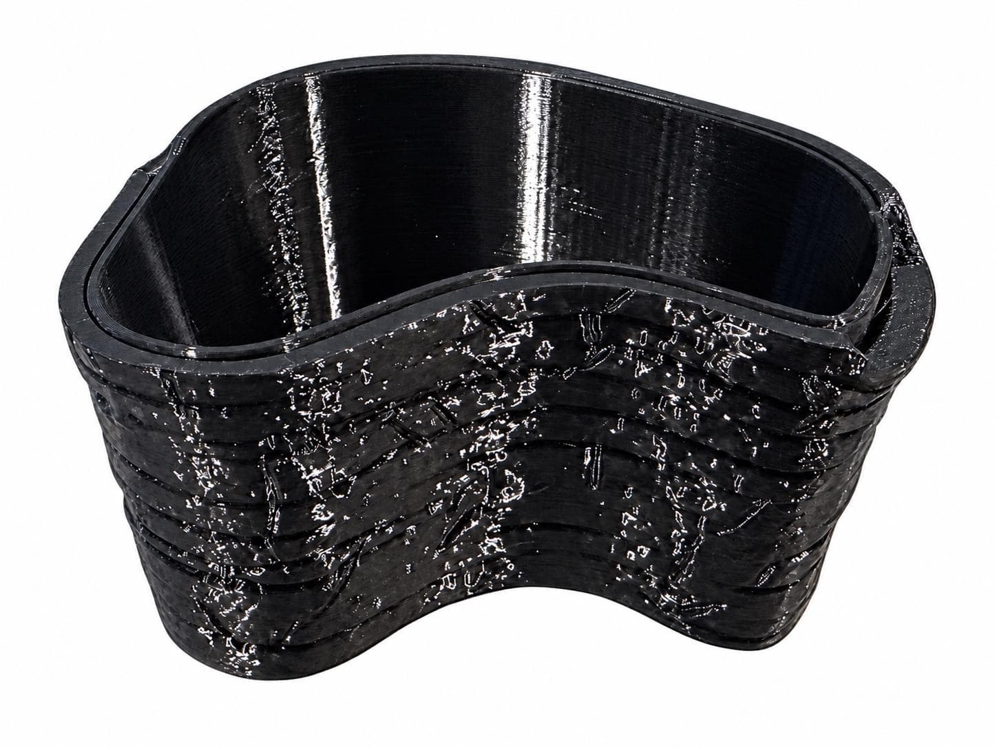 Assembled Riverbank plant cup from the front, showing its broad curved front and layered stone texture